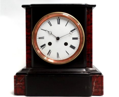 A late 19th century black slate and rouge marble mantel clock - the white enamel dial set out with Roman numerals, fitted wit