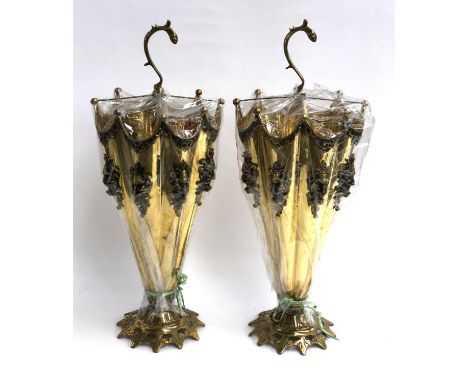 A pair of modern brass stick stands in the form of umbrellas with applied lion mask detail, new in wrapping 