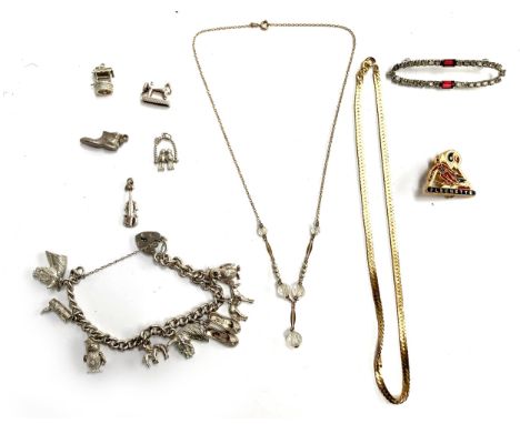 A small lot of jewellery to include a 9ct gold, faux pearl and glass bead necklace, 4g; together with a silver charm bracelet