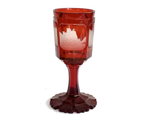 A bohemian ruby glass chalice, with four engraved panels depicting German cathedrals, 28cmH 
