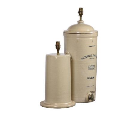 A Berkefeld London stoneware water filter fitted as a lamp base, 53cm high, and another stoneware lamp base, 66cm high overal