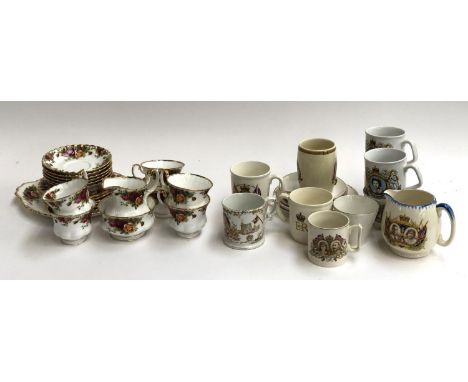 A quantity of Royal Albert Country Roses tea service (21 pieces); commemorative china to include a small jug etc 