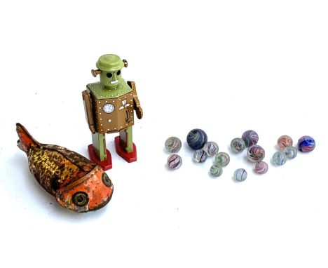 Sixteen 19th century marbles (af), together with a tin plate goldfish and robot 