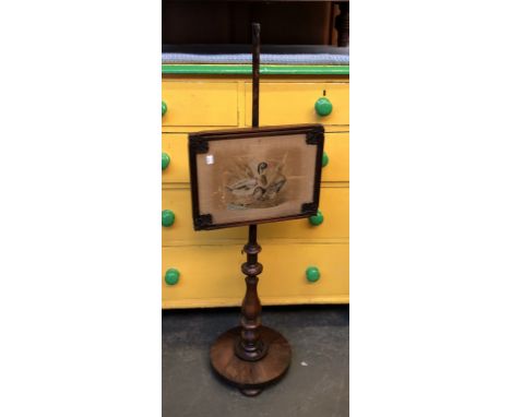 A 19th century rosewood pole fire screen, the panel having an embroidered mallard duck and drake, approx. 114cmH 