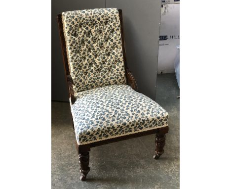 A late 19th/early 20th century button back bedroom chair, recently upholstered, on turned legs and casters, 60cmW 