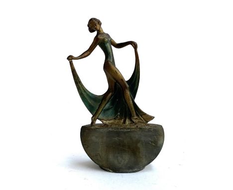 An Art Deco spelter table lighter, with striker, in the form of a dancing lady, 17.5cmH 