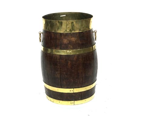 An oak barrel stick stand, coopered construction, brass bands and twin brass handles, 51cmH 