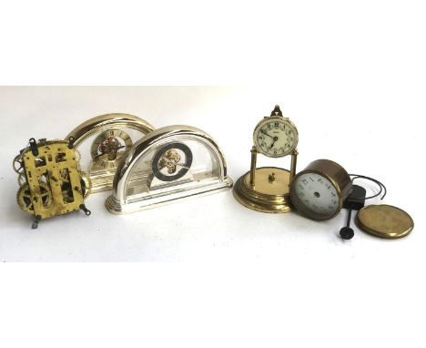 Two Rhythm quartz mantel clocks together with various clock parts 