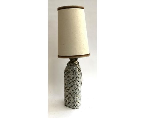 A 1970s mosaic table lamp, triangular base, with tall shade, 82cmH to top of shade 