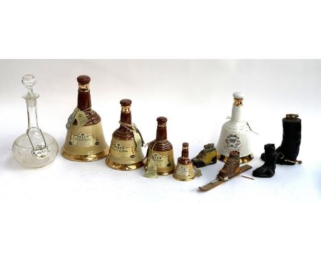 Breweriana Interest: Four graduating Bell's ceramic bell form whiskey bottles, together with a decanter with a Coalport sherr