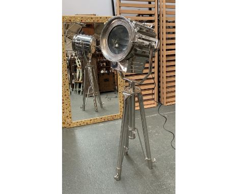 A large chrome stage light style spotlight floorstanding lamp, on adjustable tripod base 