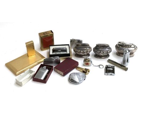 A collection of lighters to include Ronson Crown table lighter; Ronson Adonis; Prince; Penguin; Engine turned cigarette case;