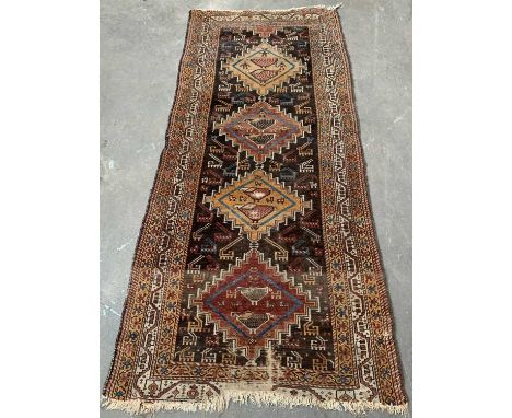 EASTERN CARPET RUNNER, multi-coloured with repeating central diamond pattern, multi bordered edge and tasselled ends, 90 x 21