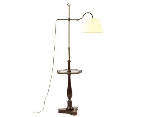 An adjustable library lamp, the integral table with raised brass gallery over baluster form column on a tripod base, and anot