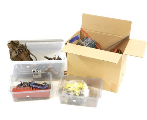An assortment of hand tools, including clamps, chisels, mitres