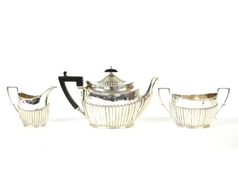 A three piece silver tea set, James Dixon & Sons, Sheffield, teapot 12.5cm high