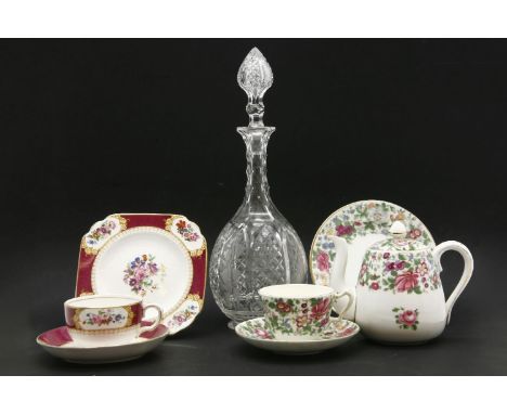 Two boxes with glass and china items, including two tea sets, decanters, and green, white and gilt glass vase table lamp