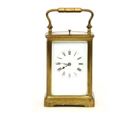 A brass carriage clock, with an enamel face, with repeater, 13.5cm high, with a travelling case, worn