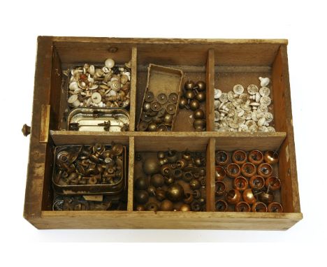 A box of brass box feet and knobs, ivory knobs, etcProvenance: The property of a gentleman dealer