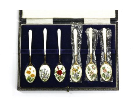 A cased set of six sterling silver enamel tea/coffee spoons, each bowl of the spoon hand painted with different flowers ename