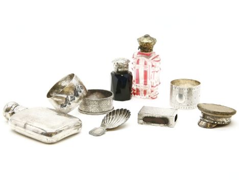 A novelty silver mounted officers cap pin cushion, 5.5cm, two glass scent bottles, a silver match sleeve, a hip flask, a Geor