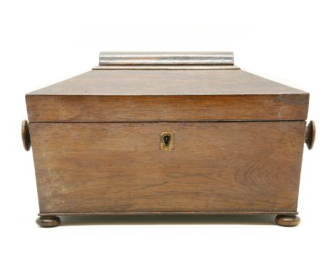 A Regency rosewood tea caddy of sarcophagus form, on squat bun feet, 32 cm wide x 16 cm deep x 17 cm high