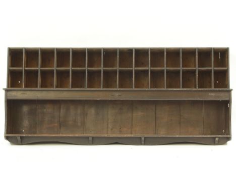 A 19th century pine postmasters hanging stationary cabinet, with divisional pigeon hole section above open shelf , 151 cm x 2