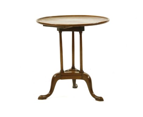 A George III mahogany dish top table, on an unusual column tripod base