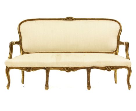 A Louis XVI style sofa, the gilt frame carved with flower heads and scrolls with silk noil upholstery, 162cm wide, 56cm deep,