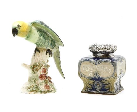 A Royal Doulton Lambeth tea caddy, with silver top, together with Beswick parrot