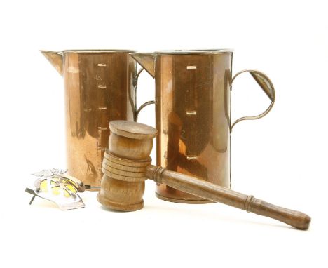 A large copper hunting horn and one other, together with copper measuring jugs and other metalware, an oversized gavel, an AA