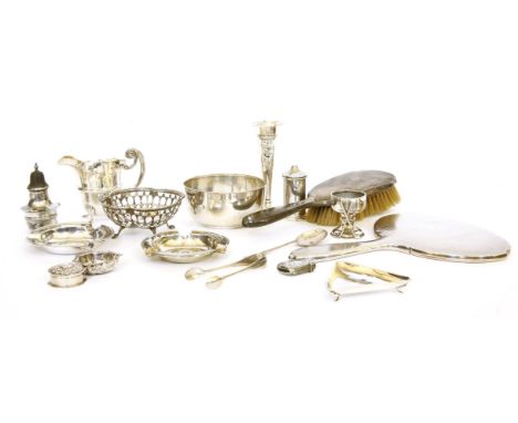 A collection of silver items: ashtrays, pierced dish, bowls, cream jug, vesta, pill box and two silver banned dressing table 