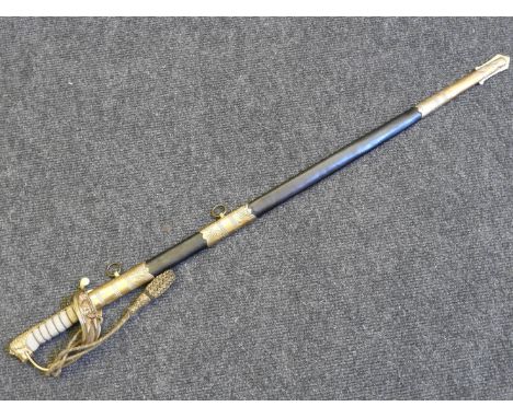 An early 20th century naval officers sword, the gilt metal handle with shagreen grip and branded tassel, the blade marked Caf