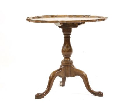 A mahogany tripod table, with a shaped circular top, with a moulded edge, 78.5cm diameter