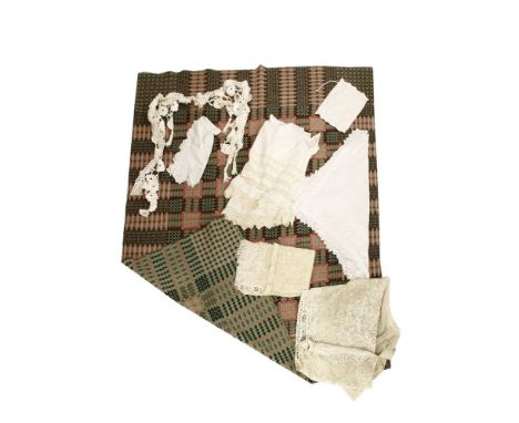 A Welsh blanket in pink and green, a small collection of antique textiles to include table cloths, lace, etc
