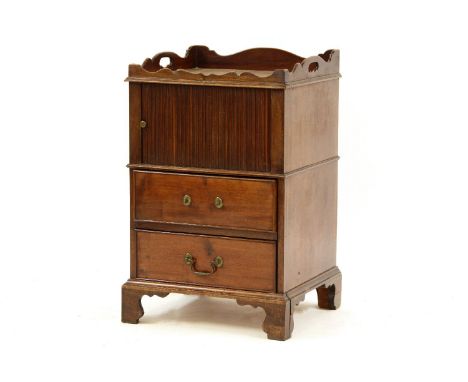 A George III mahogany tray top bedside commode, the tambour fronted cupboard, above two drawers on bracket feet, 50cm wide, 4
