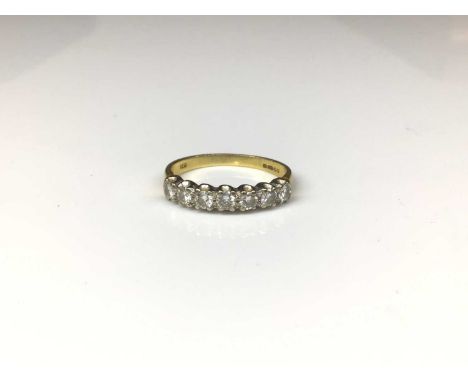 18ct gold diamond seven stone ring with a row of seven brilliant cut diamonds, estimated to weigh approximately 0.55cts in to