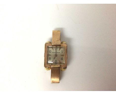 Jaeger Le Coultre gold cased watch with square dial, number and arrow head markers, in gold case with large gold lugs, 34mm l
