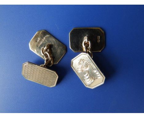 A pair of rectangular 9ct gold cufflinks engraved with heraldic beast 