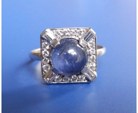 A cabochon sapphire & diamond square cluster ring in white metal 