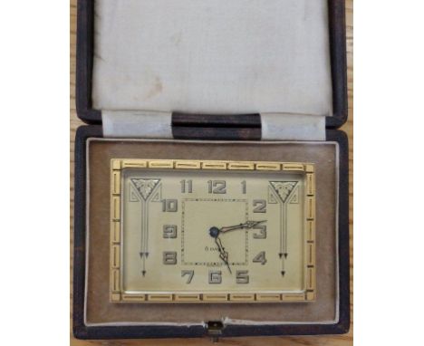 A cased gilt metal travelling clock 