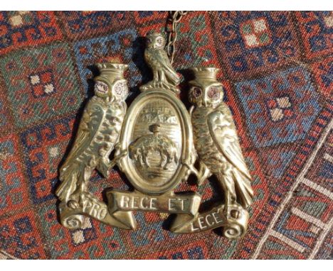 A brass traction engine plate -'Pro Rege et Lege' with red glass inlay to owls' eyes 