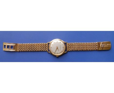A 1950's gent's Jaeger-LeCoultre wrist watch, the silvered dial with centre seconds, gold batons &amp; arabic numerals, the c