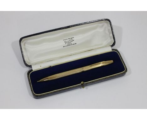 9CT GOLD PEN a 9ct gold ball point pen with engine turned decoration, in a fitted box and marked for Rood Diamond Merchants, 