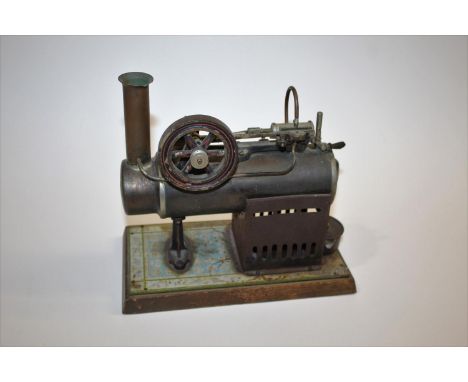 GEBRUDER BING - MODEL STEAM ENGINE a stationary model steam engine with small burner, mounted on a wooden plinth. Marked with