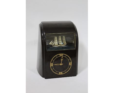 VITASCOPE BAKELITE SHIP CLOCK a Vitascope brown bakelite mantle clock, with an automated Ship (in working order). Marked to t