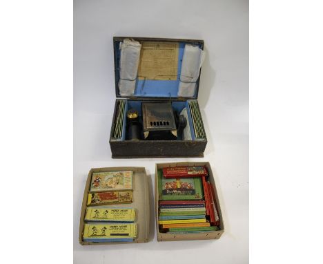 CASED GERMAN MAGIC LANTERN &amp; SLIDES - FABRIK MARKE a boxed magic lantern with brass lens, with a variety of children's re