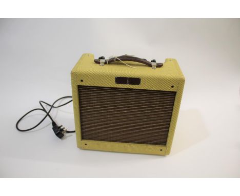 FENDER TWEED SERIES GUITAR AMP - BRONCO a 1994 Solid State 15 watt amp with a tweed covered case, Serial No T10798 with a 8 i