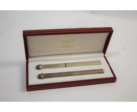 MUST DE CARTIER - PEN SET including a fountain pen and ballpoint pen, both with a textured finish and in a fitted leather cas