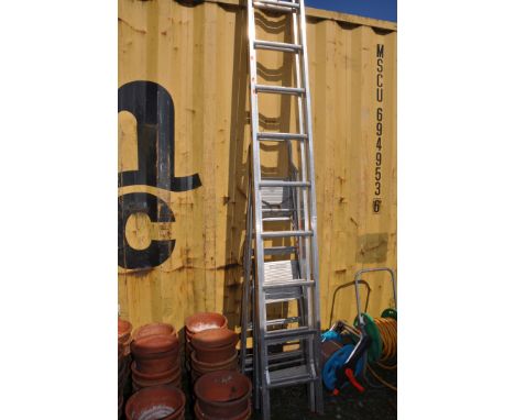 AN ALUMINIUM DOUBLE EXTENSION LADDER WITH NINE RUNGS TO EACH 280cm length along with two step ladders and two hose reels ( on